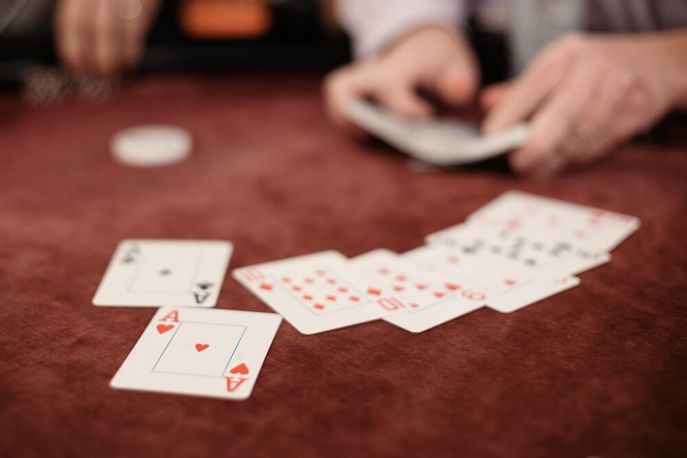 Selective,Focus,Of,Playing,Cards,Displayed,On,A,Poker,Table