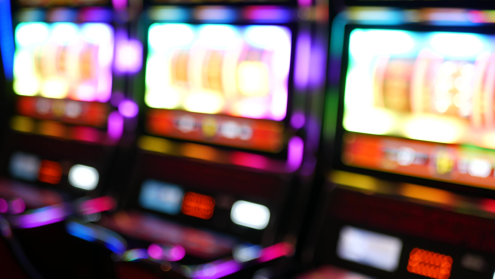 Defocused,Slot,Machines,Glow,In,Casino,On,Fabulous,Las,Vegas