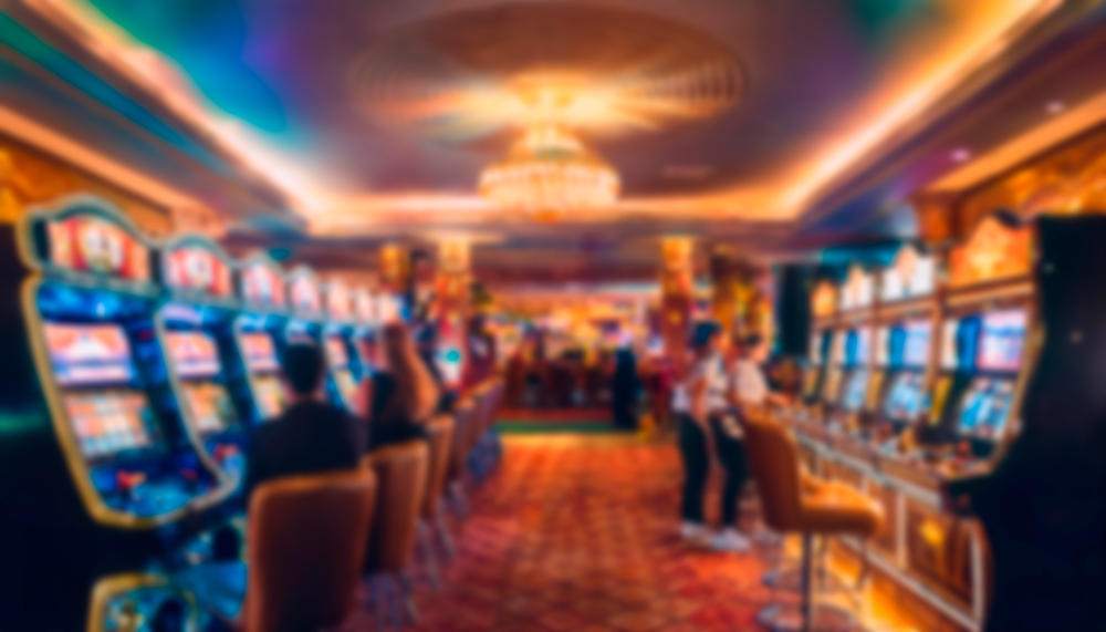 Blurry,Image,Of,A,Lively,Casino,Interior,With,People,Playing