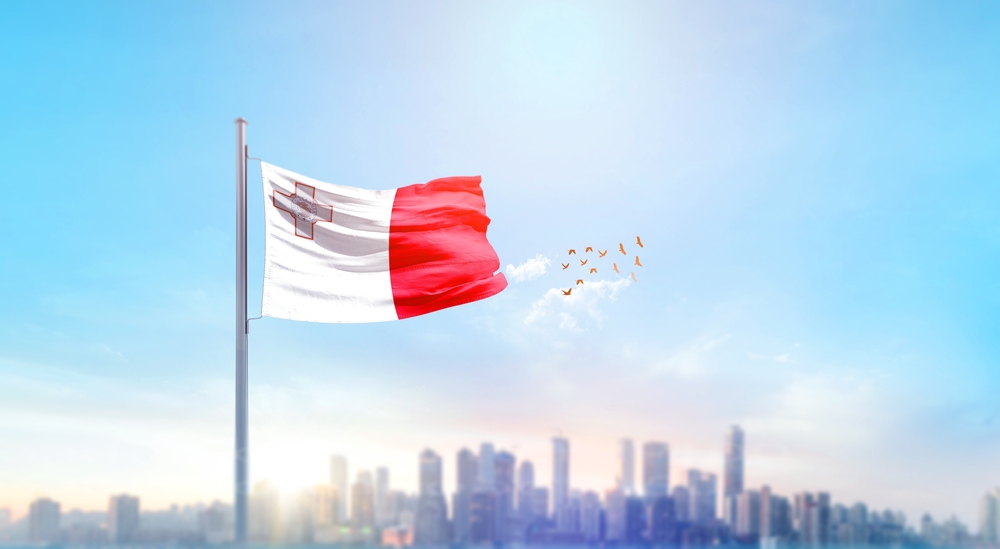 Malta,National,Flag,Waving,With,Skyline,And,Buildings.,Malta,National